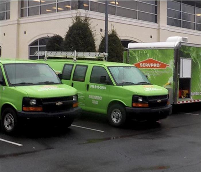 SERVPRO green vehicle parked outside a building in Charlotte