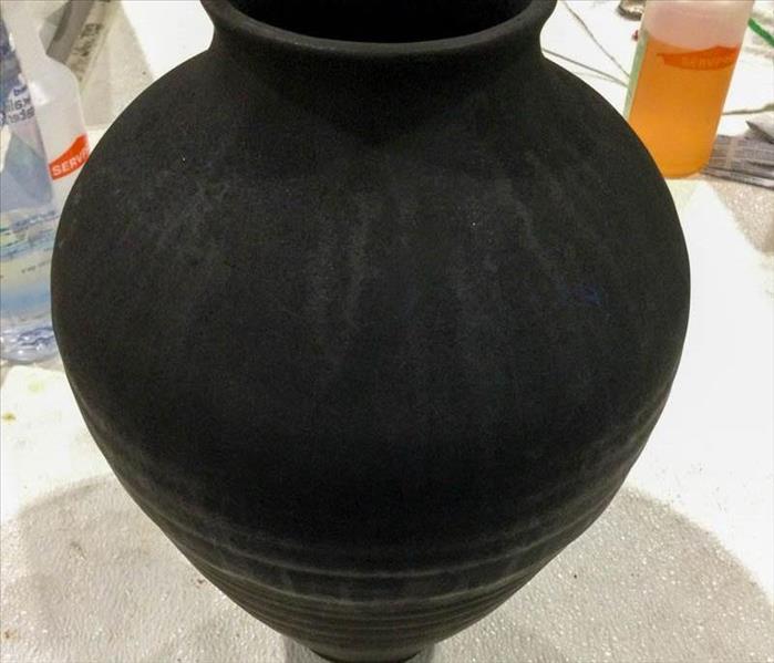 Soot covered vase.